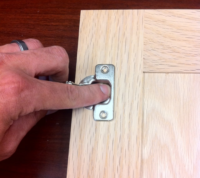 press the hinge into the hole